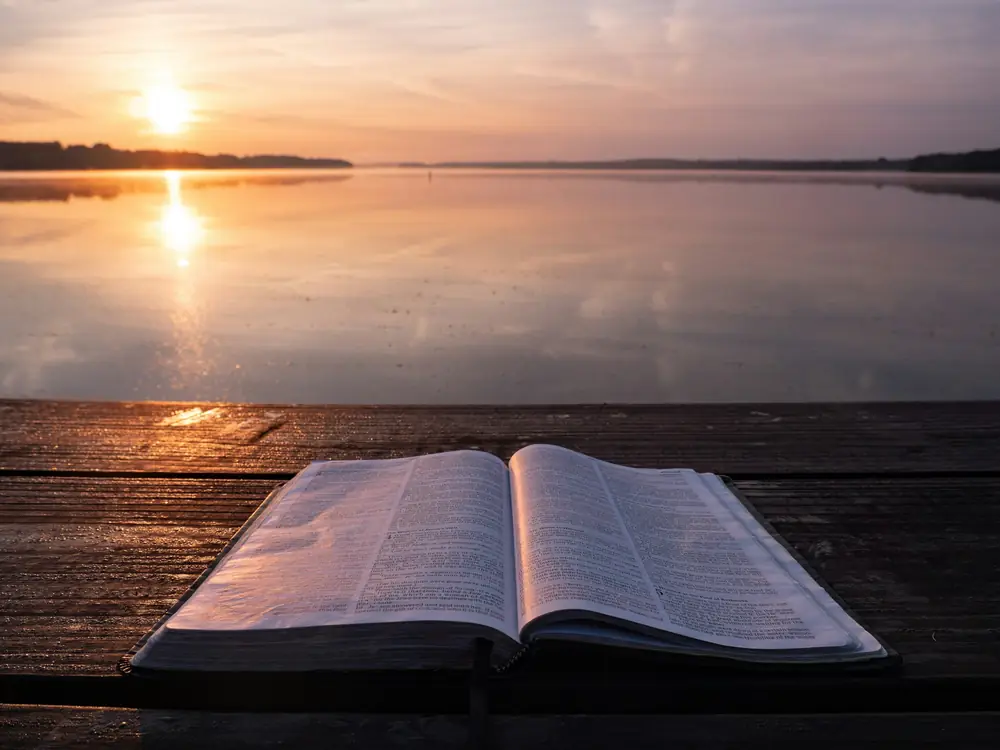 Sunrise light over an open Bible